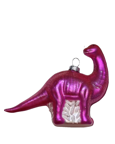 A glittery magenta pink dinosaur Christmas ornament with a silver metal hanger loop at the top, shown against a plain white background.