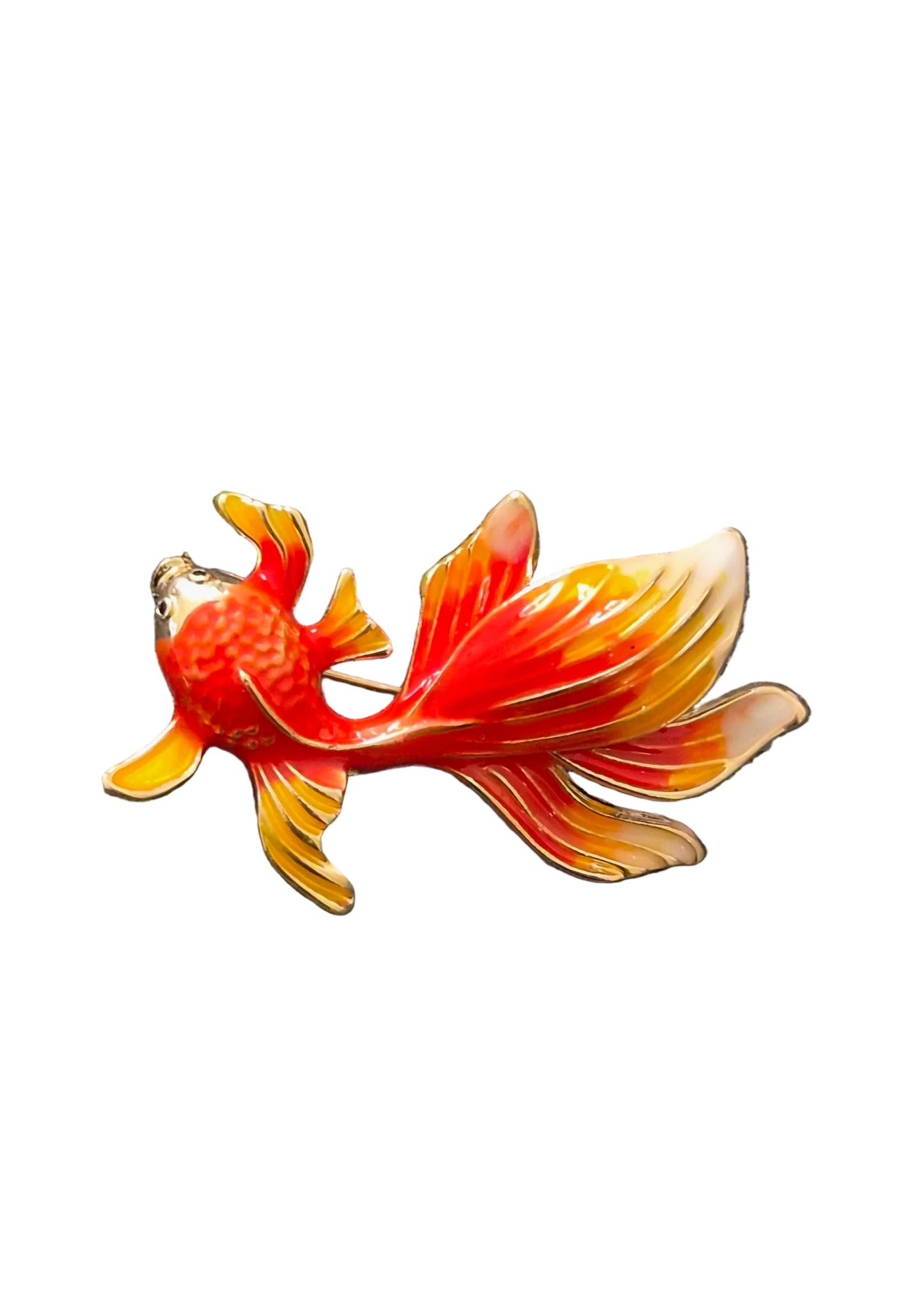 A goldfish-shaped enamel pin in vibrant orange, red, and yellow.
