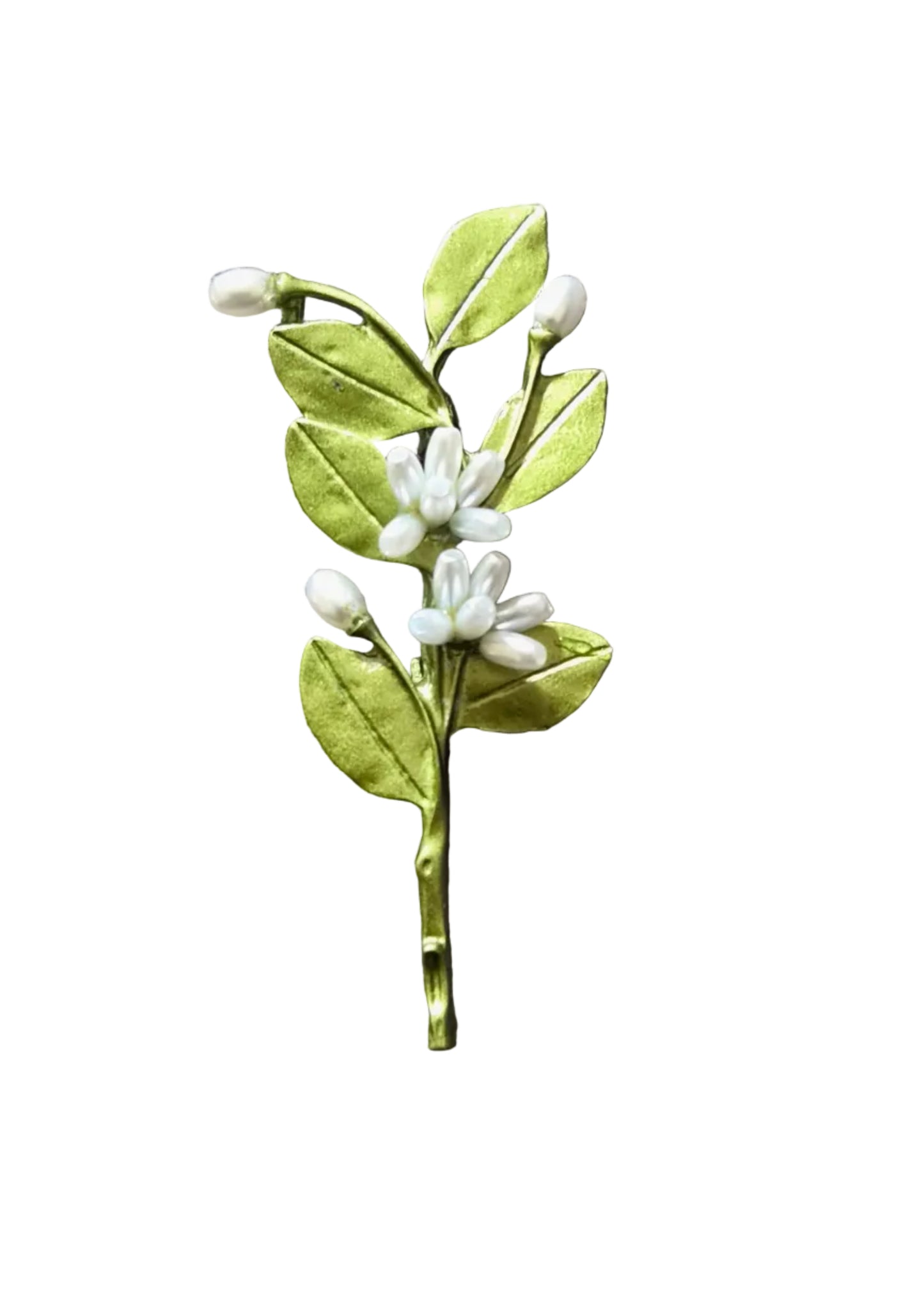 A handmade paper flower hair clip featuring green leaves and white blossoms, placed on a textured gray fabric background.