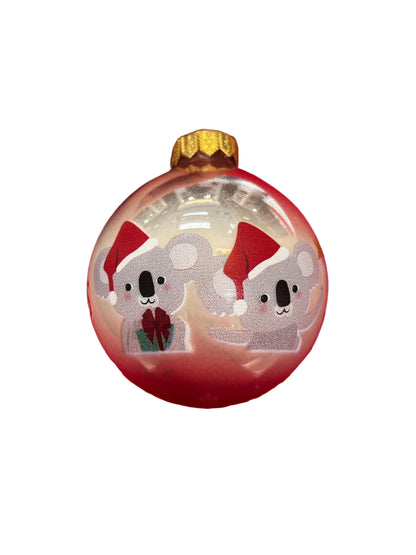 Pink bauble with koalas in Santa hats