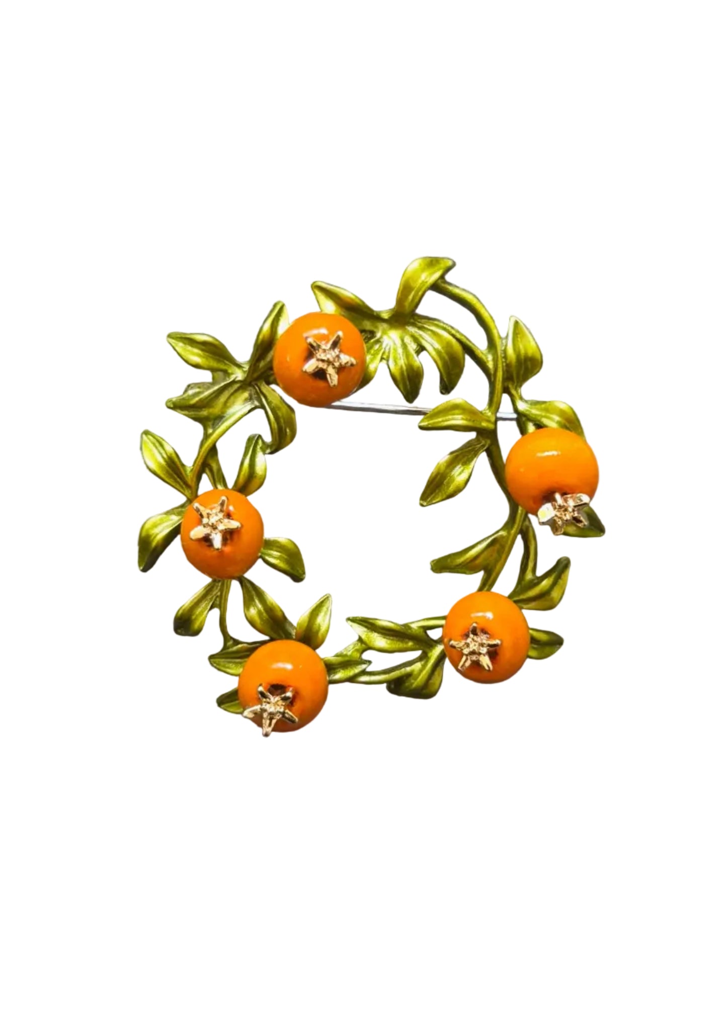 An orange and green enamel brooch shaped like a wreath of leaves with five small orange fruits.