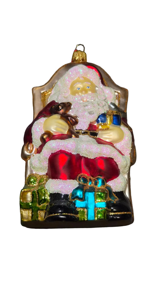 Decorative European handmade glass Christmas ornament of a Santa sitting on a golden throne