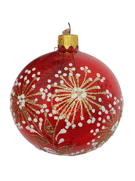 Red Christmas ornament with gold and white decorations against a white background