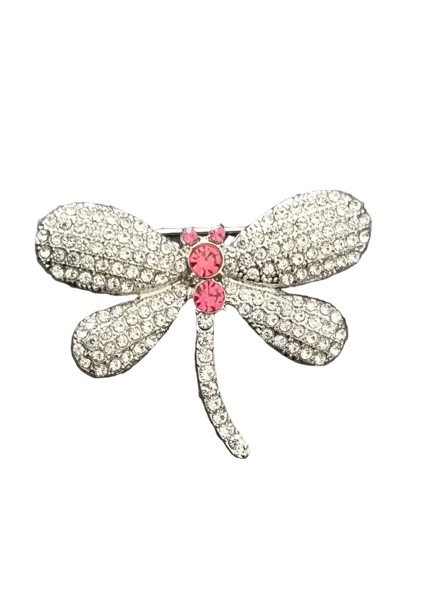A dragonfly-shaped brooch embellished with clear rhinestones and featuring a pink rhinestone center.