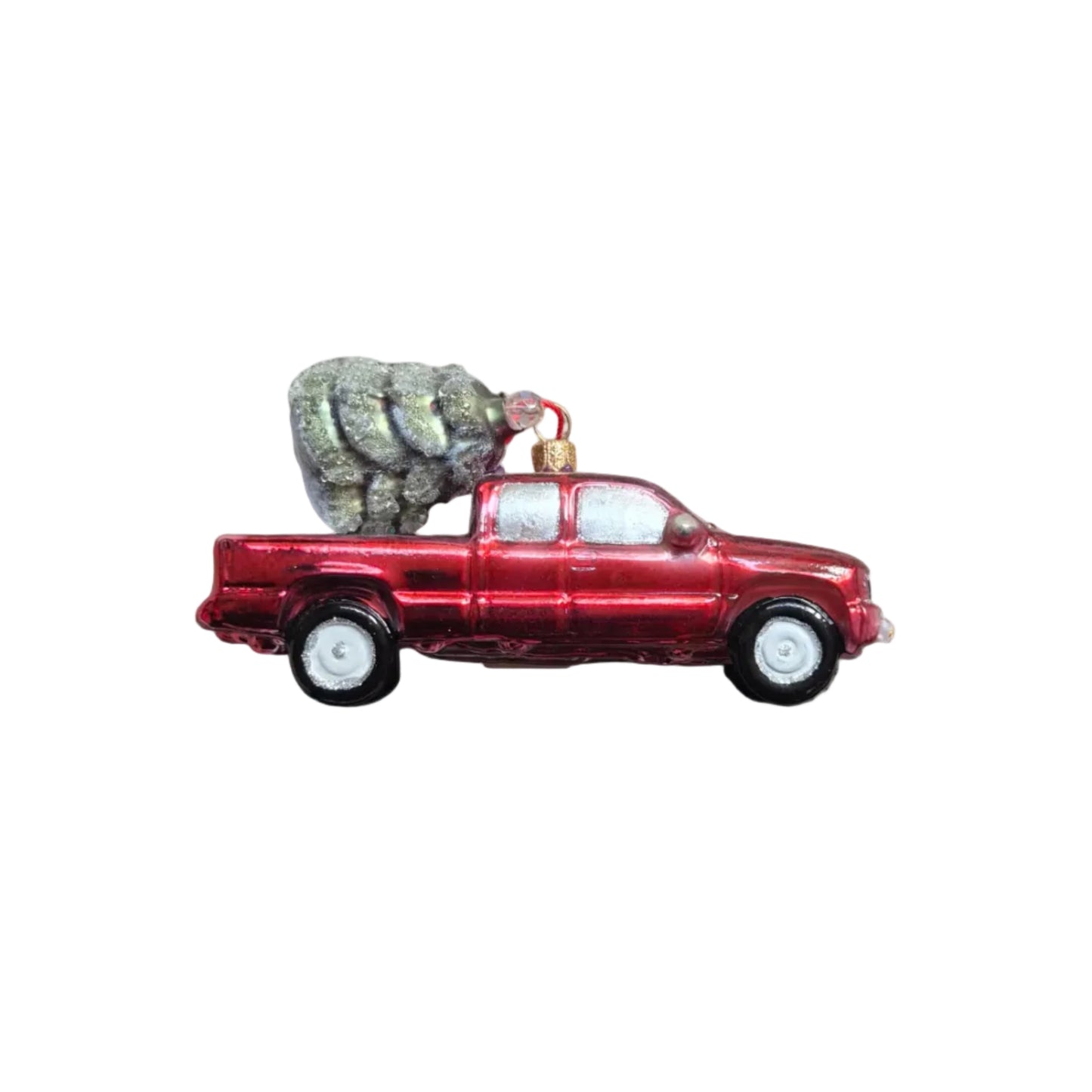 Handmade glass Christmas ornament of a ute with a Christmas tree in the back