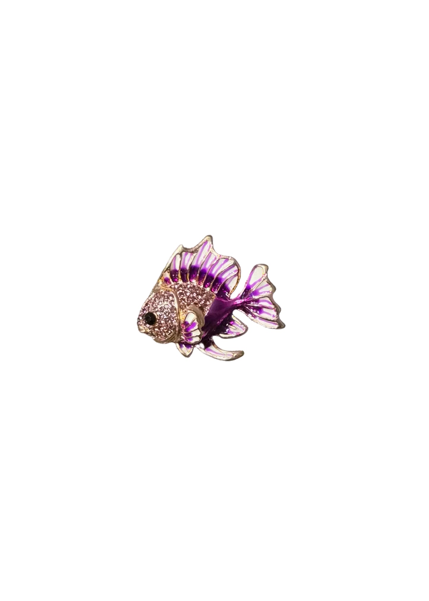 A small fish-shaped brooch with purple and white enamel detailing and a silver-toned base