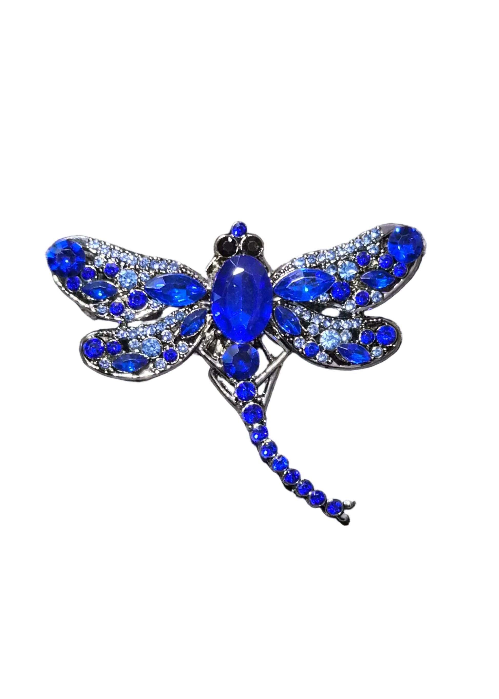 A dragonfly-shaped brooch with vivid blue crystals and a central blue oval stone