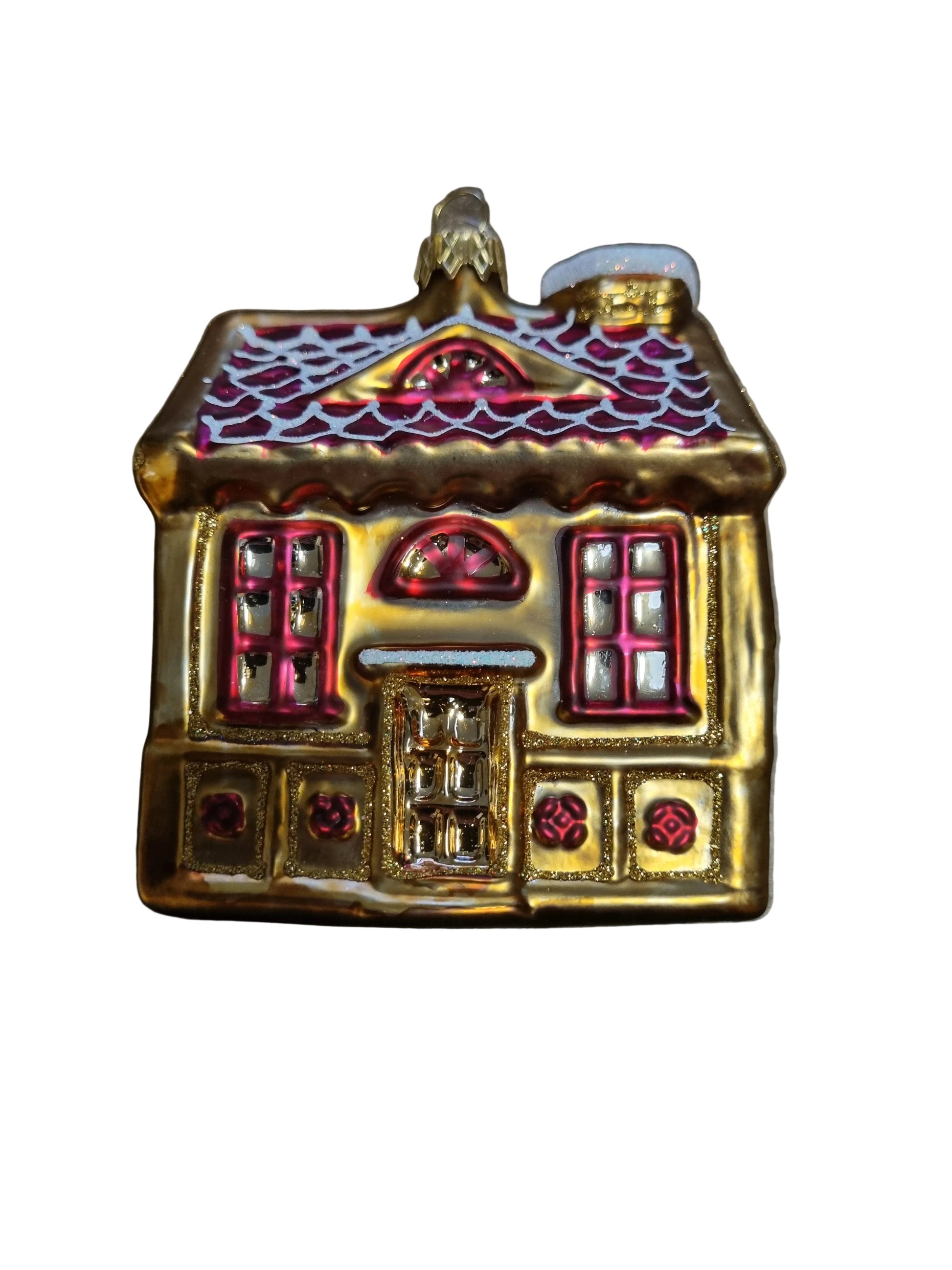 Decorative house ornament with gold and red details