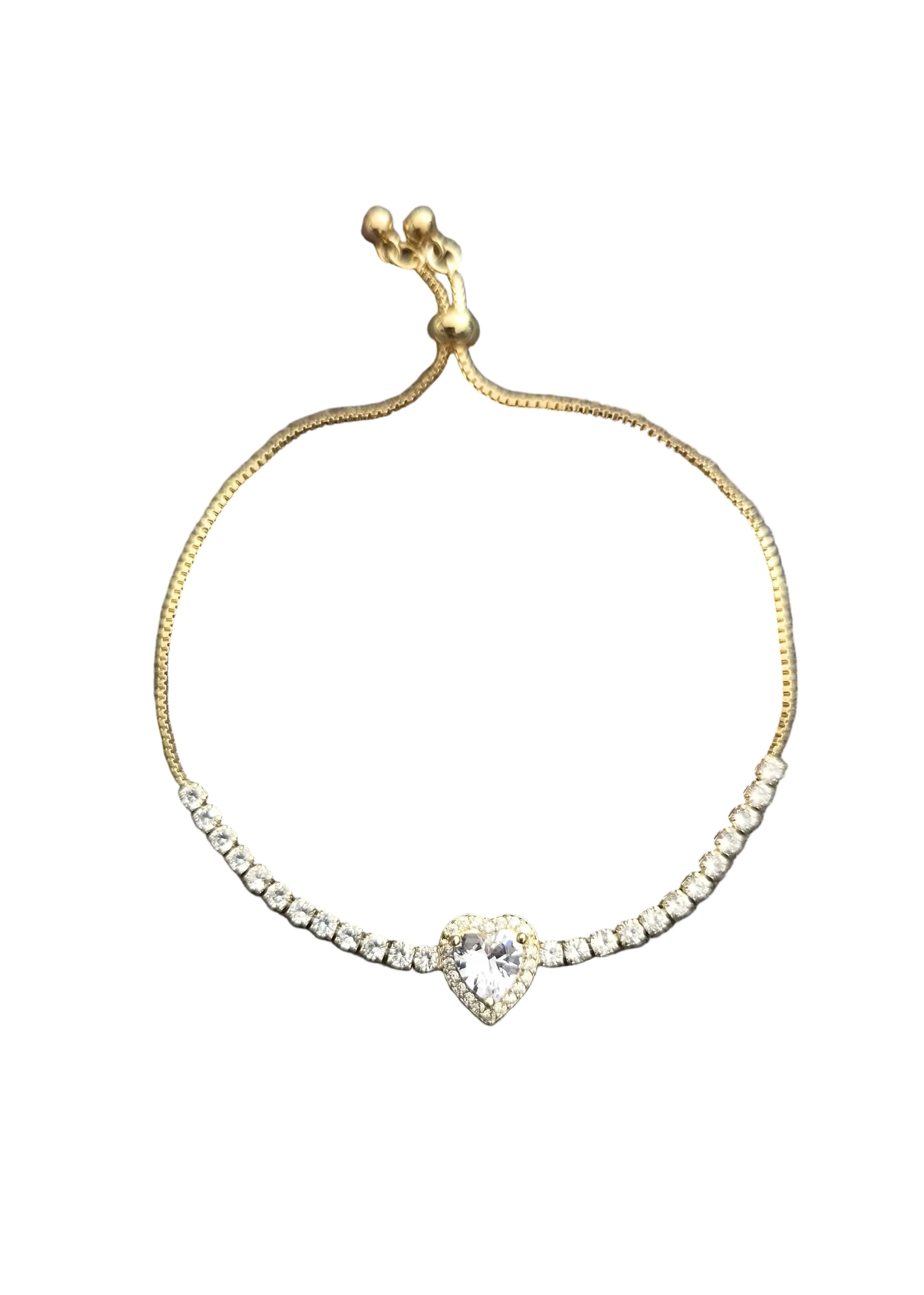 A delicate gold chain bracelet featuring a row of clear rhinestones leading to a central heart-shaped crystal.
