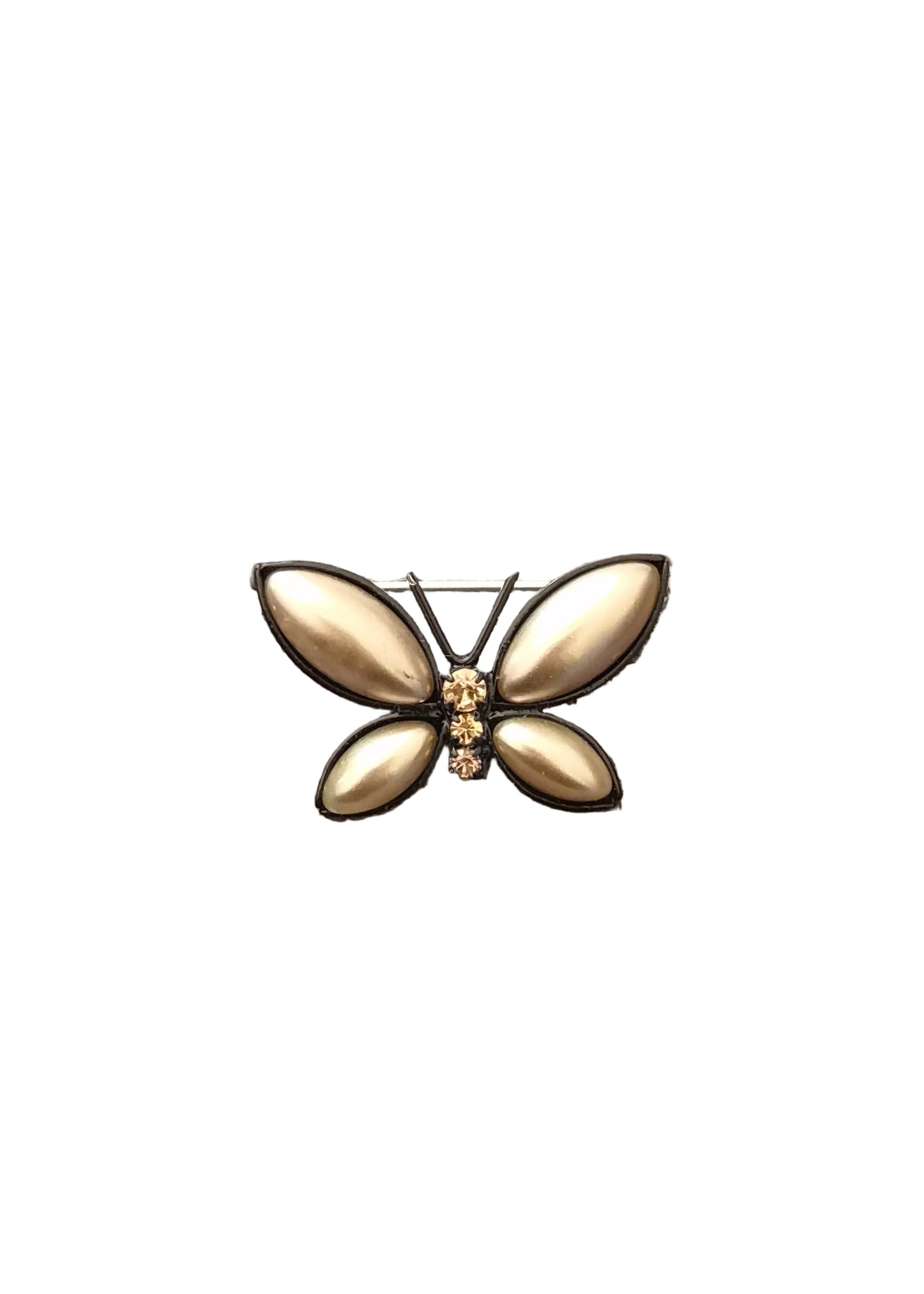 A butterfly-shaped brooch with four teardrop-shaped gold-toned petals and a small gold center detail.