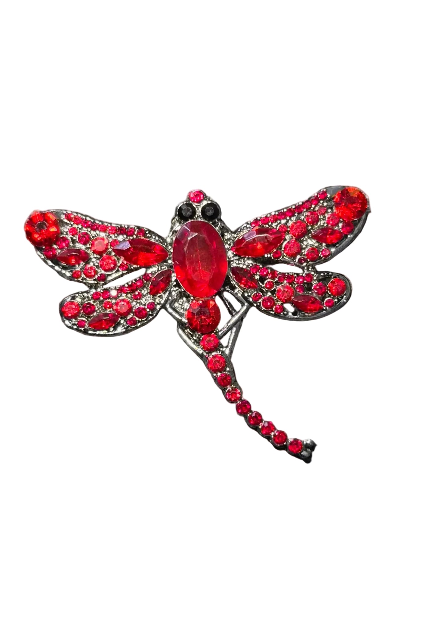 A dragonfly-shaped brooch made with red crystals and a large red oval center stone.