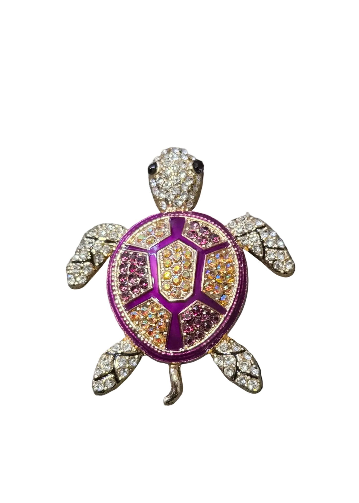 A turtle-shaped brooch or pin with a purple and gold enamel shell, set with clear rhinestones