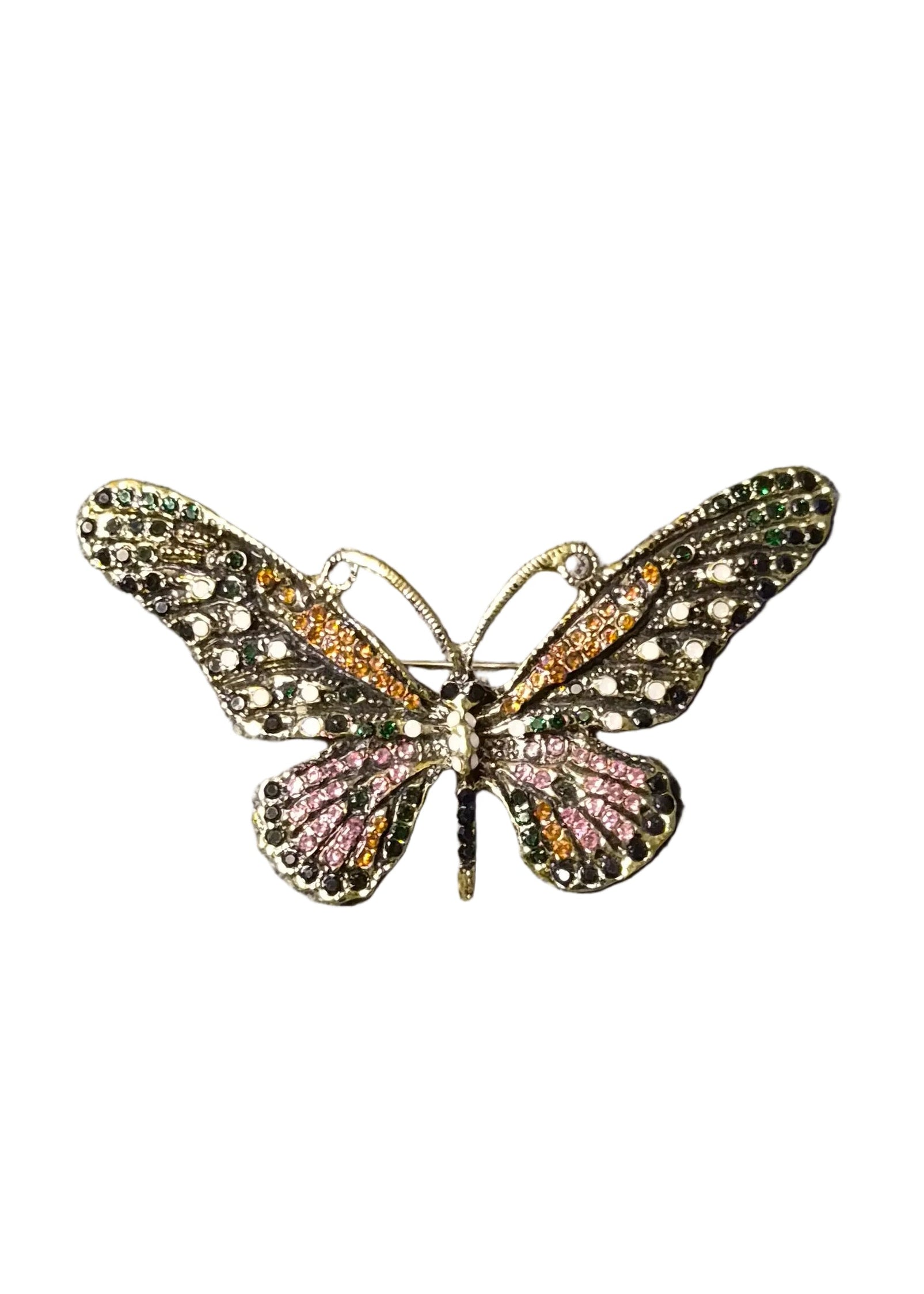A butterfly-shaped brooch with intricate gold-toned metalwork, pink rhinestones on the lower wings, and green rhinestones on the upper wings