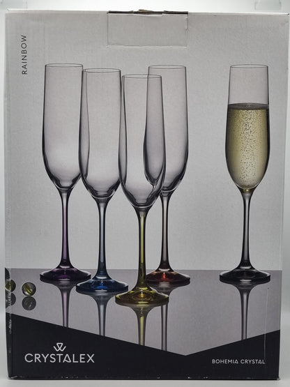 Set of crystal champagne flutes with 'Crystalex' branding on a gray background