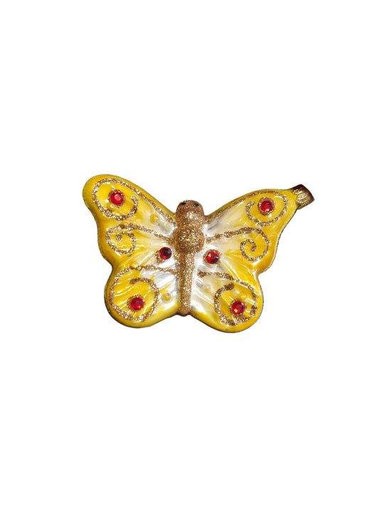 Butterfly-shaped ornament with red accents