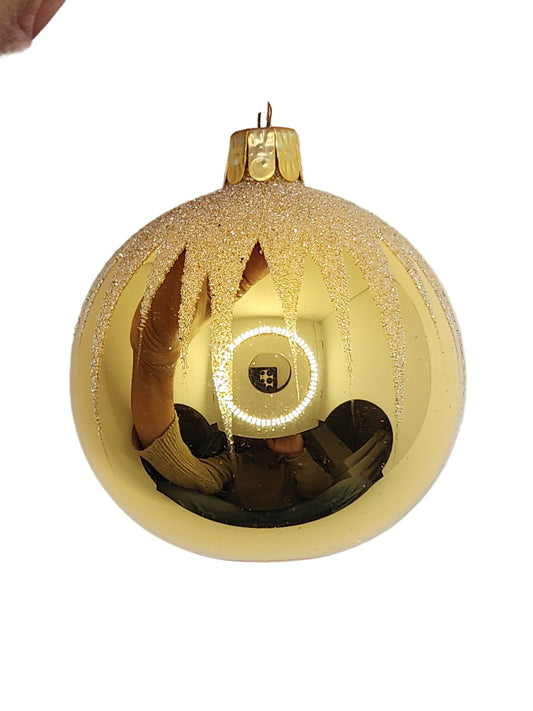 Gold ornament against a white background
