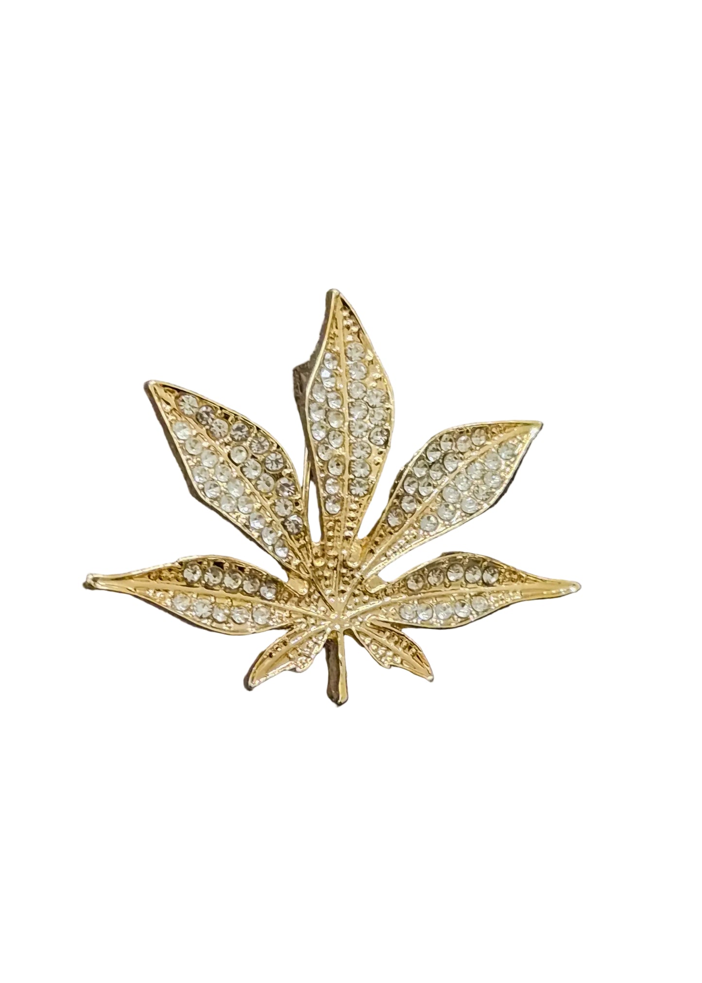 A gold leaf-shaped brooch embellished with small clear rhinestones.