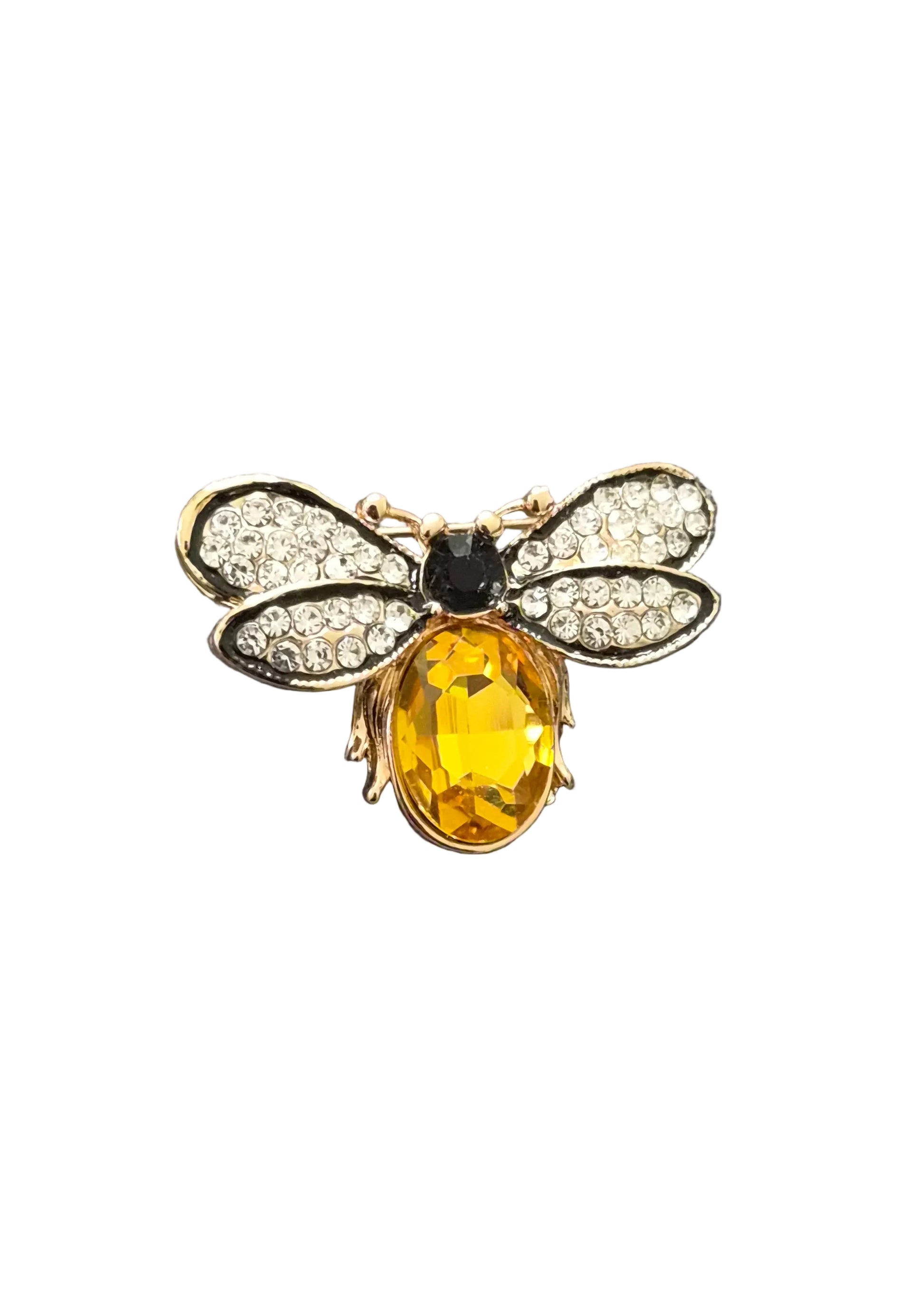 A gold bumblebee brooch with a faceted yellow crystal body, clear crystal wings, and a small black center,.