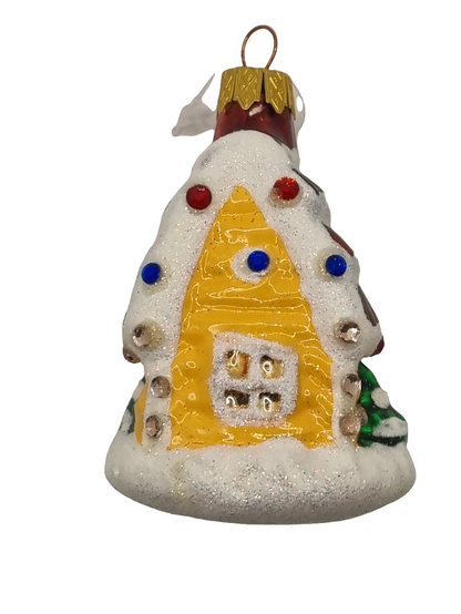 A snowy brown roof with crystals, designed to resemble a house, on a Christmas tree ornament.
